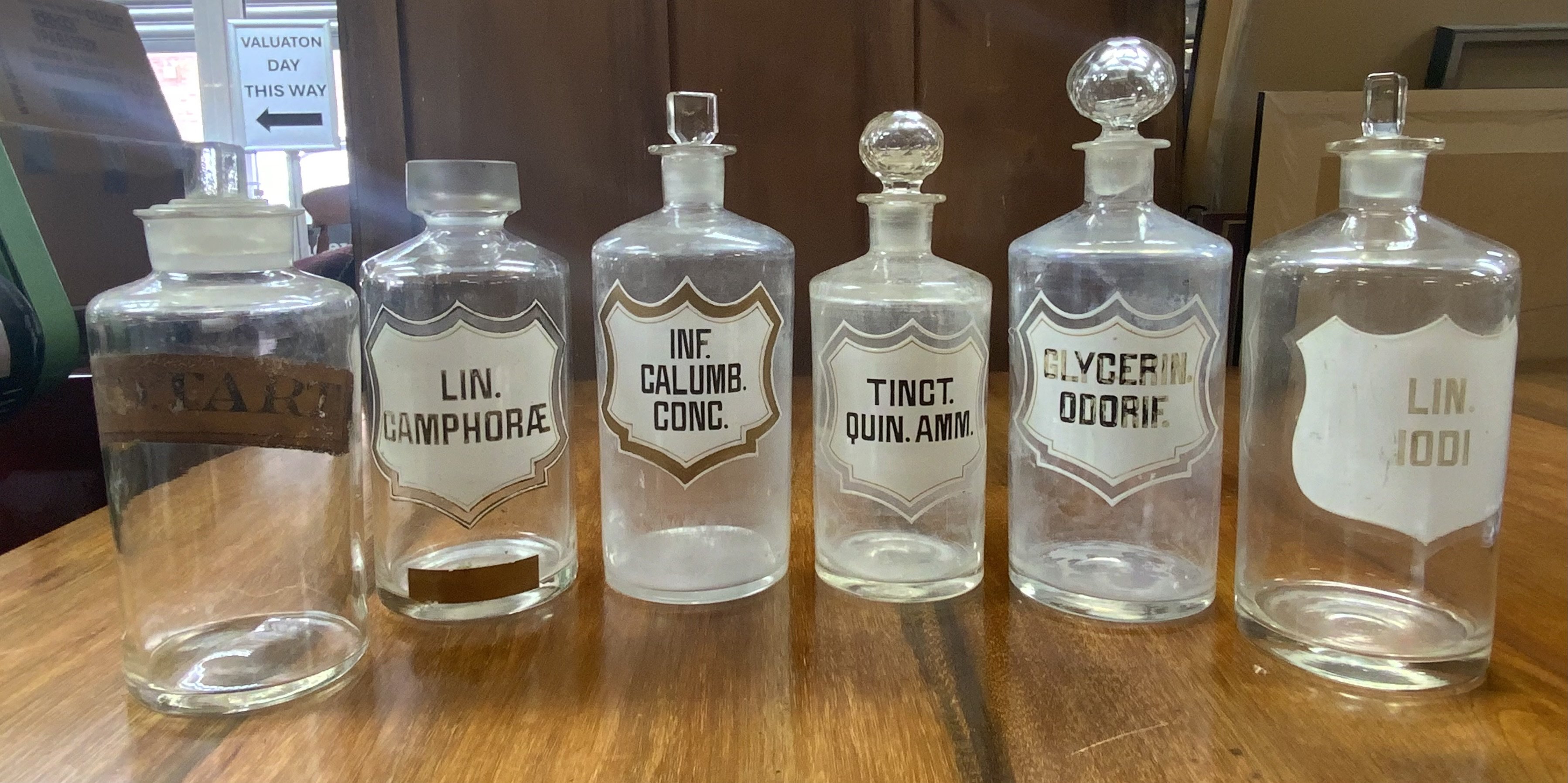 5 French enamelled apothecary bottles circa. 1840 together with an English example with applied label. (D)