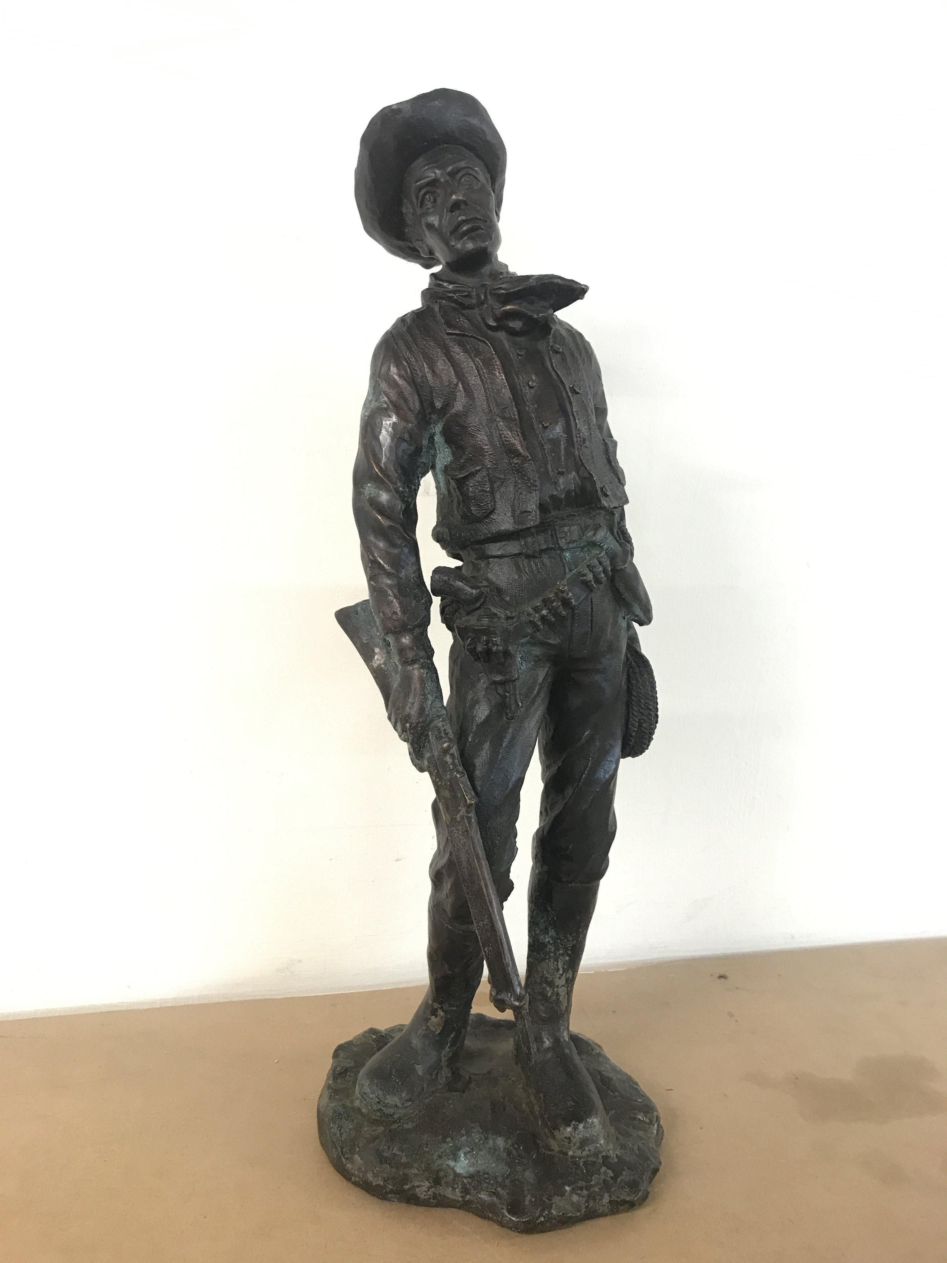 A cold cast resin Western Cowboy figure ,46cm tall. Postage category C
