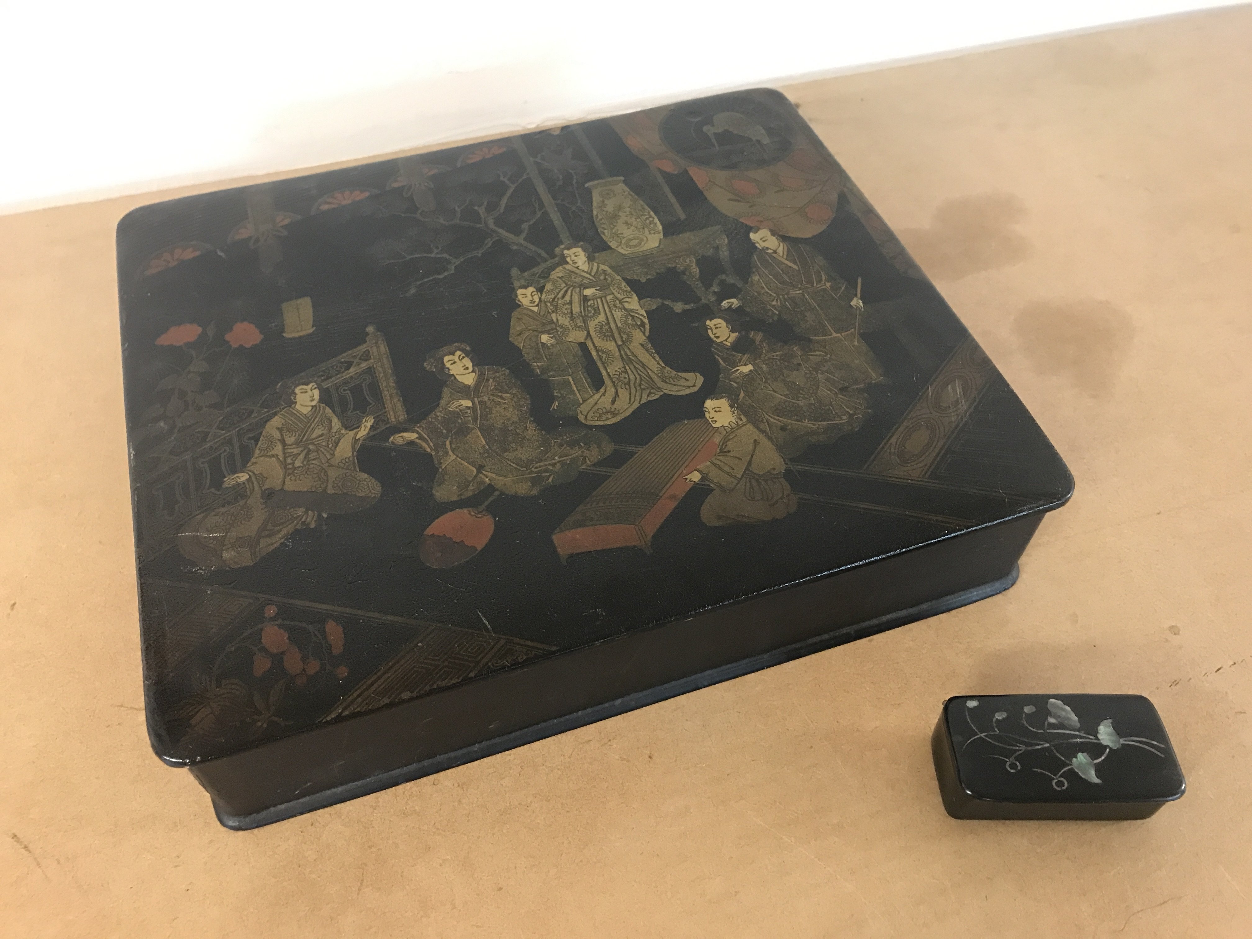 A Japanese black Lacquer paper mache box and a miniature box (27cm wide 5.5cm tall 23.5cm long). Postage category B