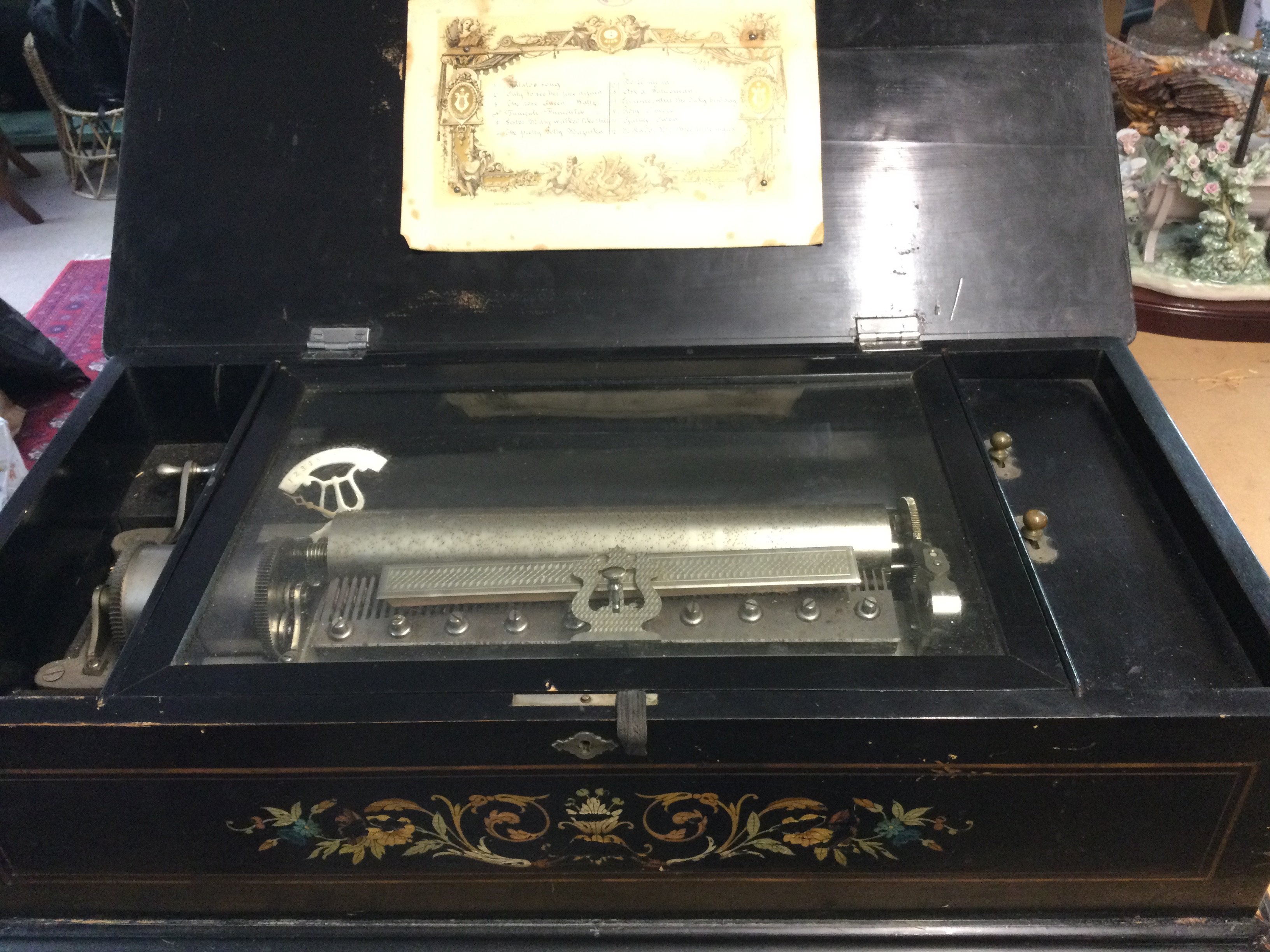 A Victorian 12 aire music box with later decoration.