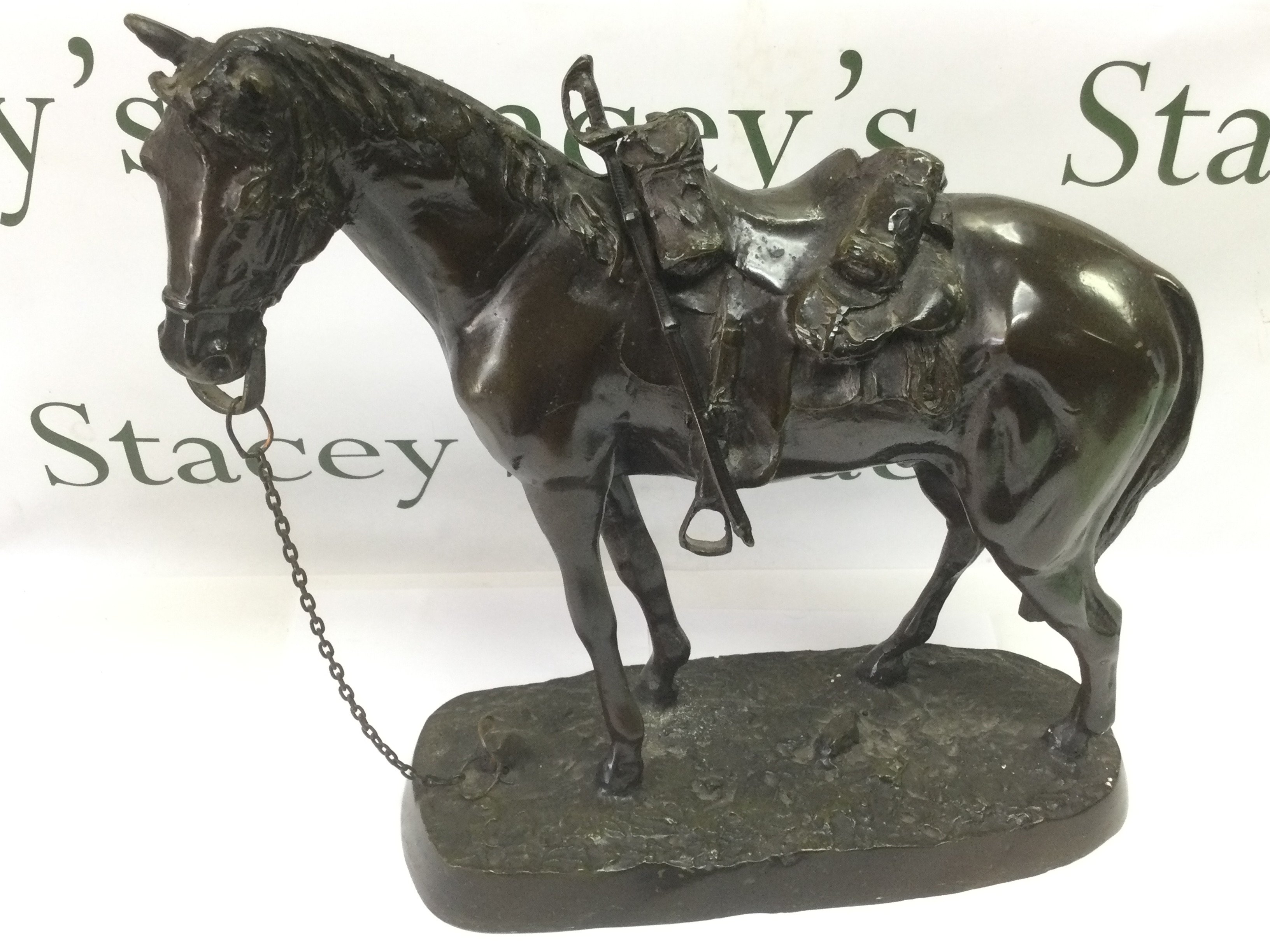 A 20th Century bronze figure of a military horse, approx height 41cm. Shipping category D.