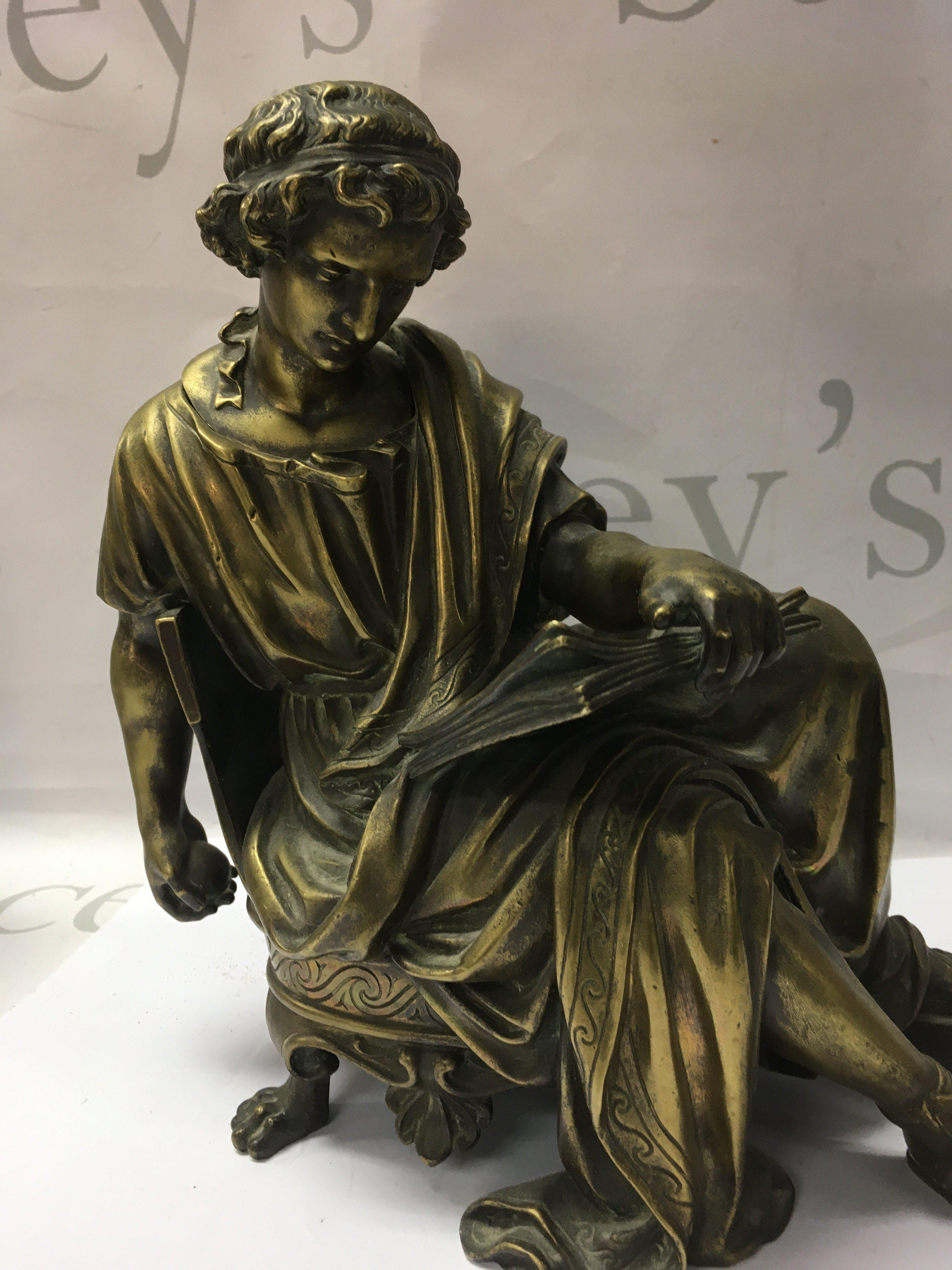 A Classical bronze in the form of a seated male figure 24 cm .