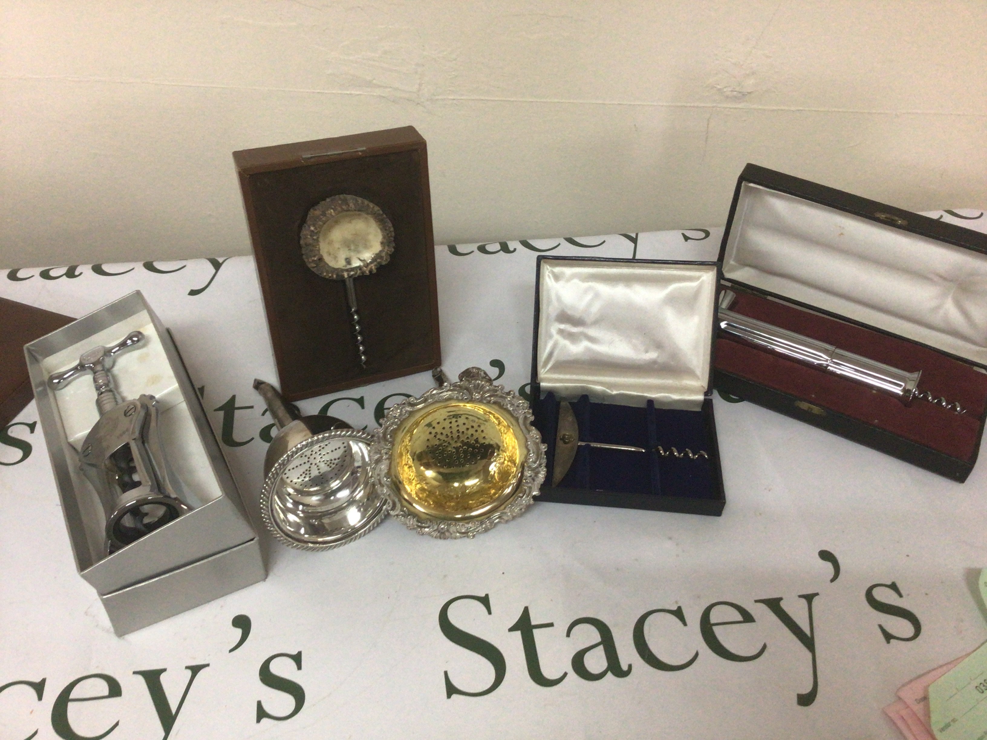 Two 19th century silver plate and parcel gilt wine funnels and boxed corkscrews