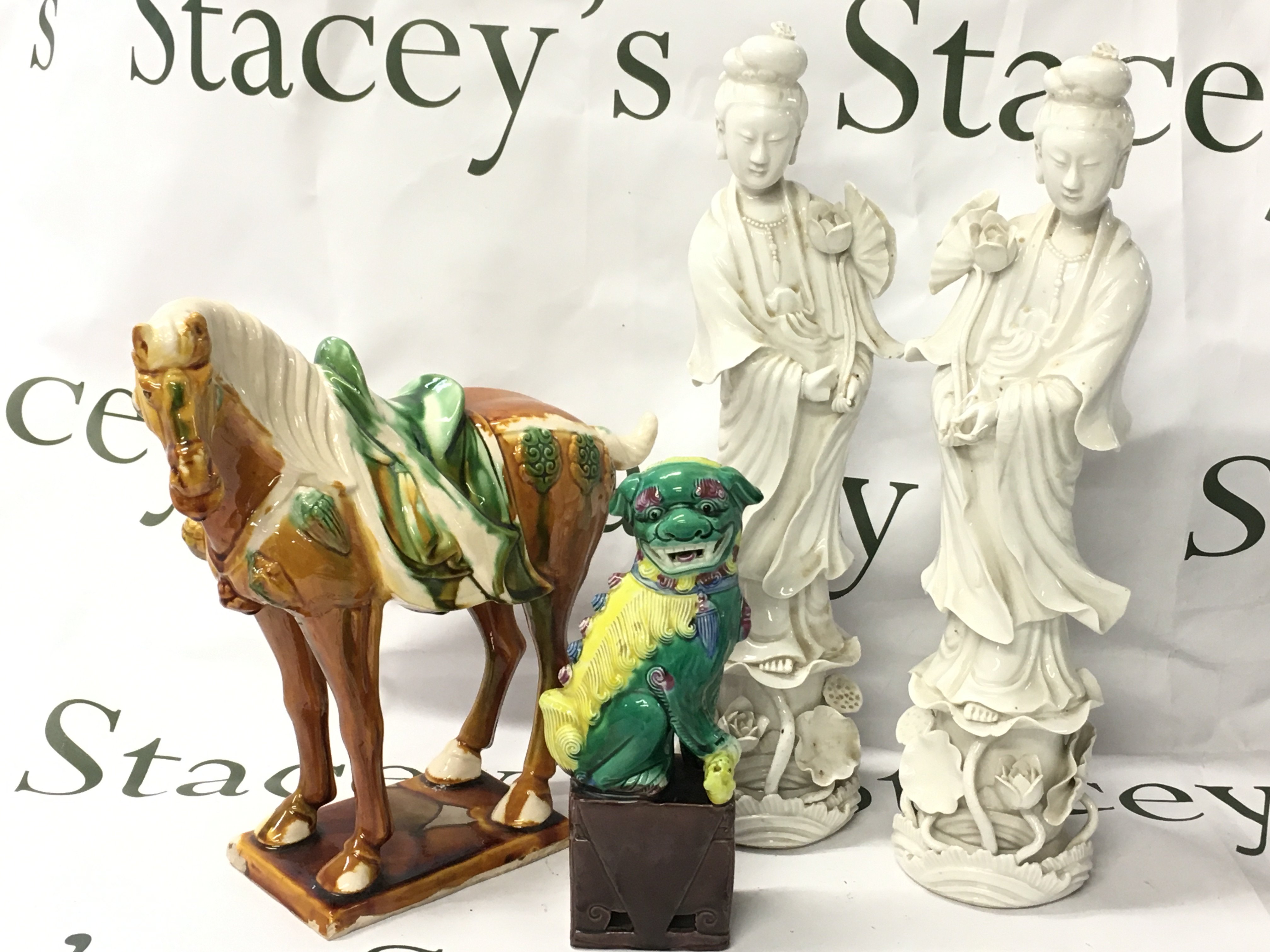 Chinese ceramics including Two Blanc De Chine porcelain figures, Tang horse and a Fu dog. 20 to 36cm tall. This lot cannot be posted