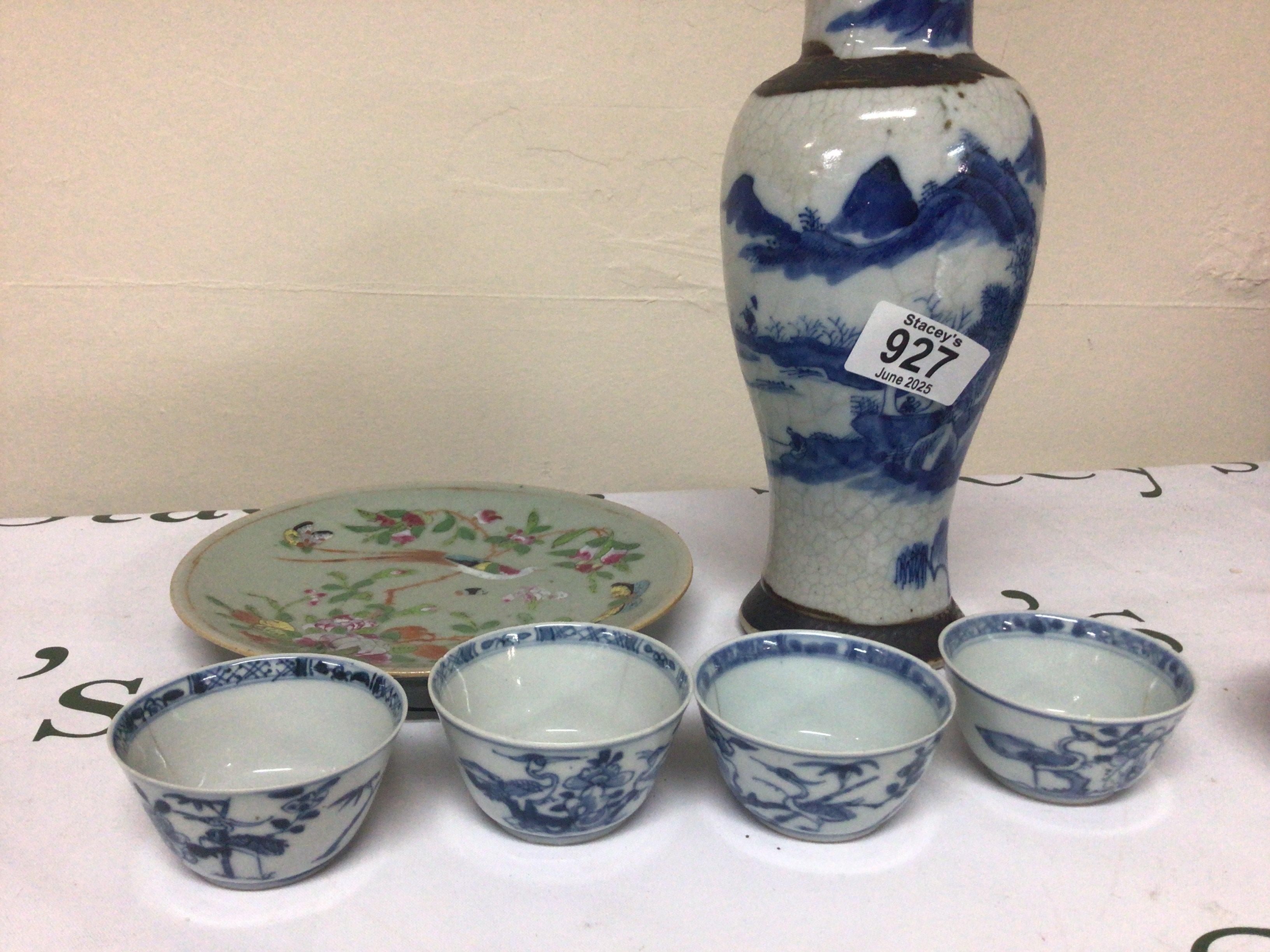 A collection of Chinese export porcelain late 18th century blue and white tea bowls a crackle ware vase celadon plate and other Chinese ceramics. Some damage. NO RESERVE