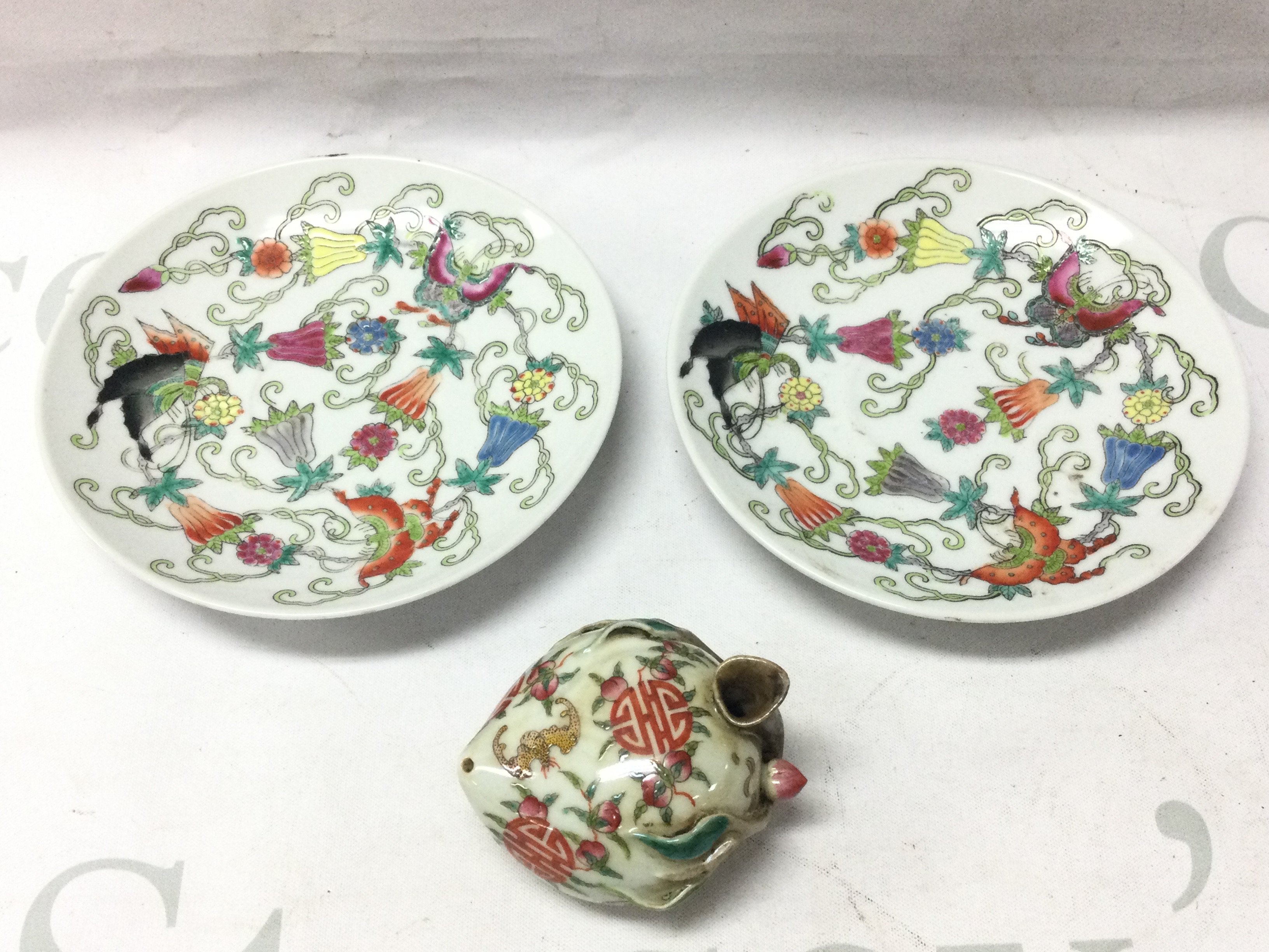 20th century Chinese Famille rose butterfly plates (14cm wide) and a porcelain Famille rose water dropper. This lot cannot be posted