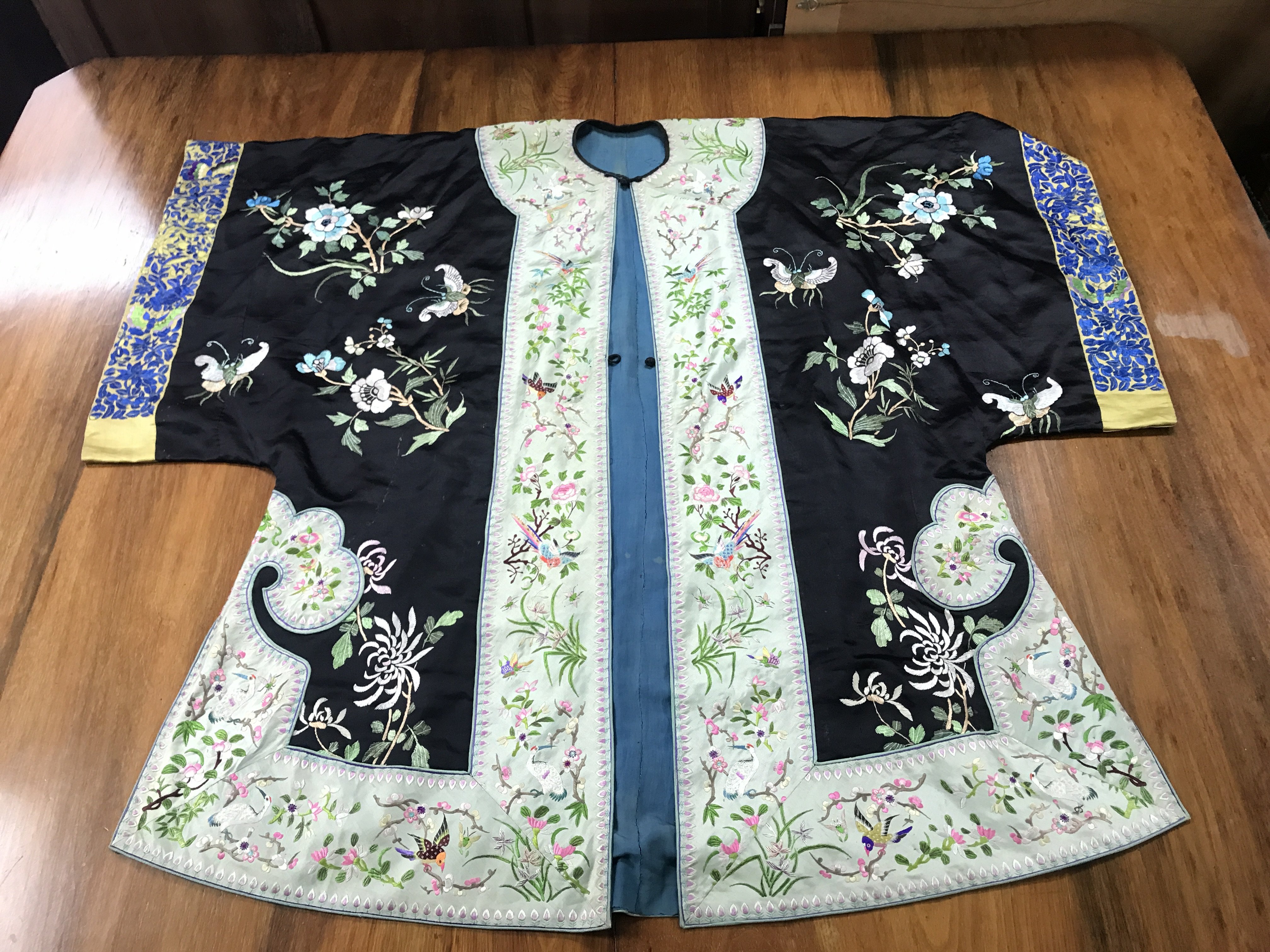 A Chinese embroidered silk robe . Postage category B