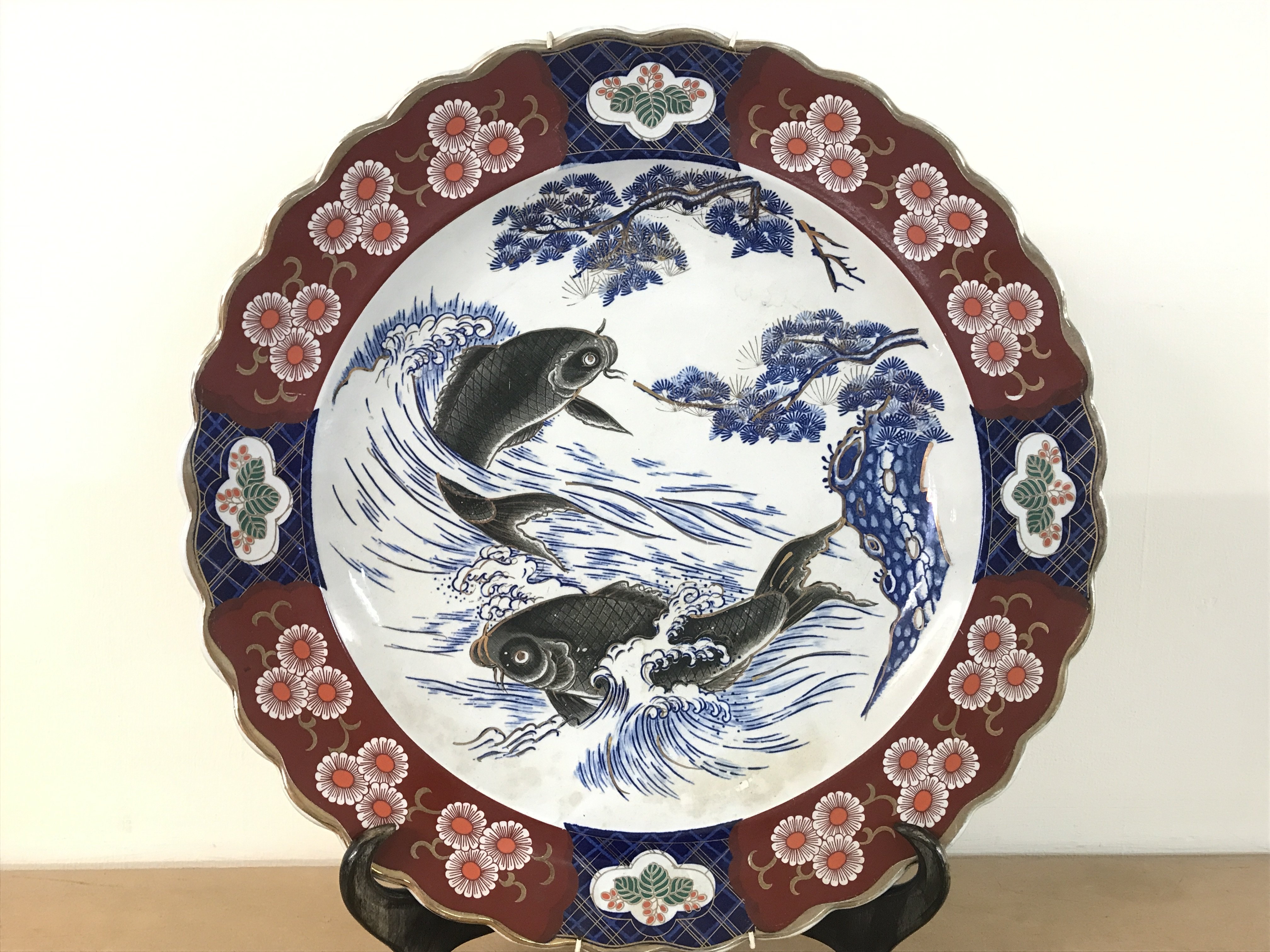 A large late 19th century Imari Koi charger. This lot cannot be posted.