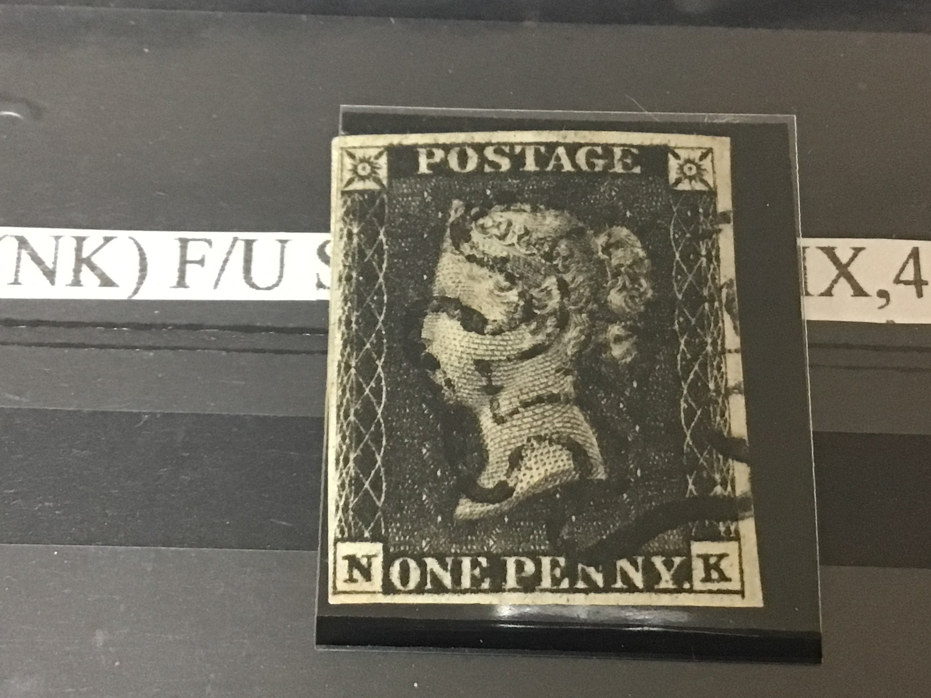 A Victorian 1840 Penny black stamp N-K in a sealed sleeve.