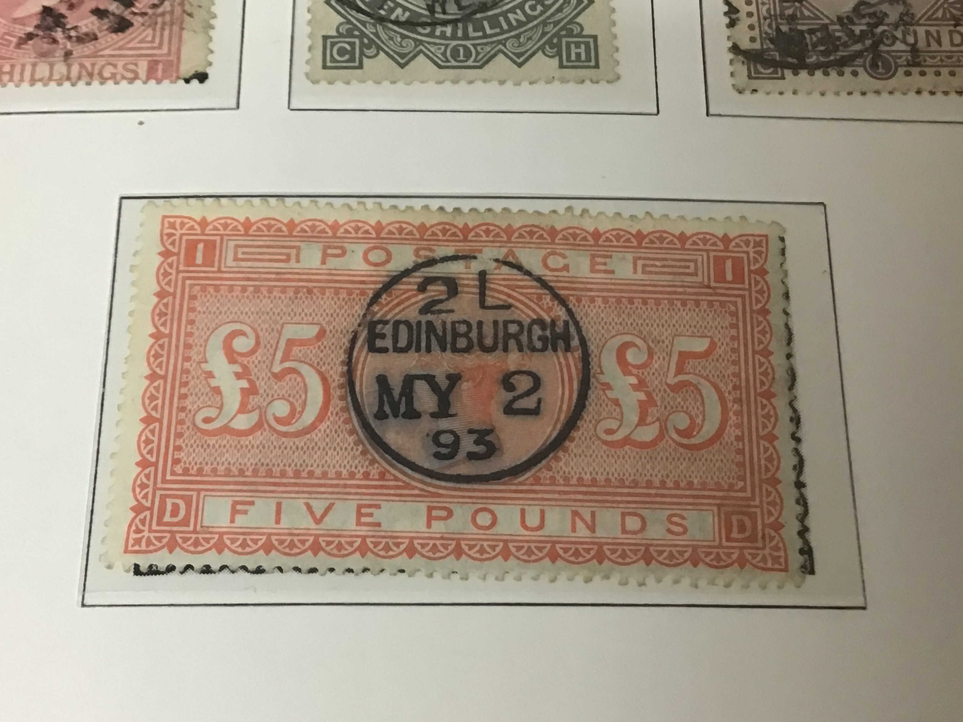 A Great Britain album of Stamps containing a Victorian Five pound Orange with Edinburgh stamp 1893 other high value Victorian stamps several one pound Victorian stamps and many others Edward VII one pound stamp High value unused George V seahorse stamps and a good selection of George VI unused stamps. The album also including a very good selection of Used and unused penny red stamps on eleven sheets. Also 1840 Penny black and other examples.