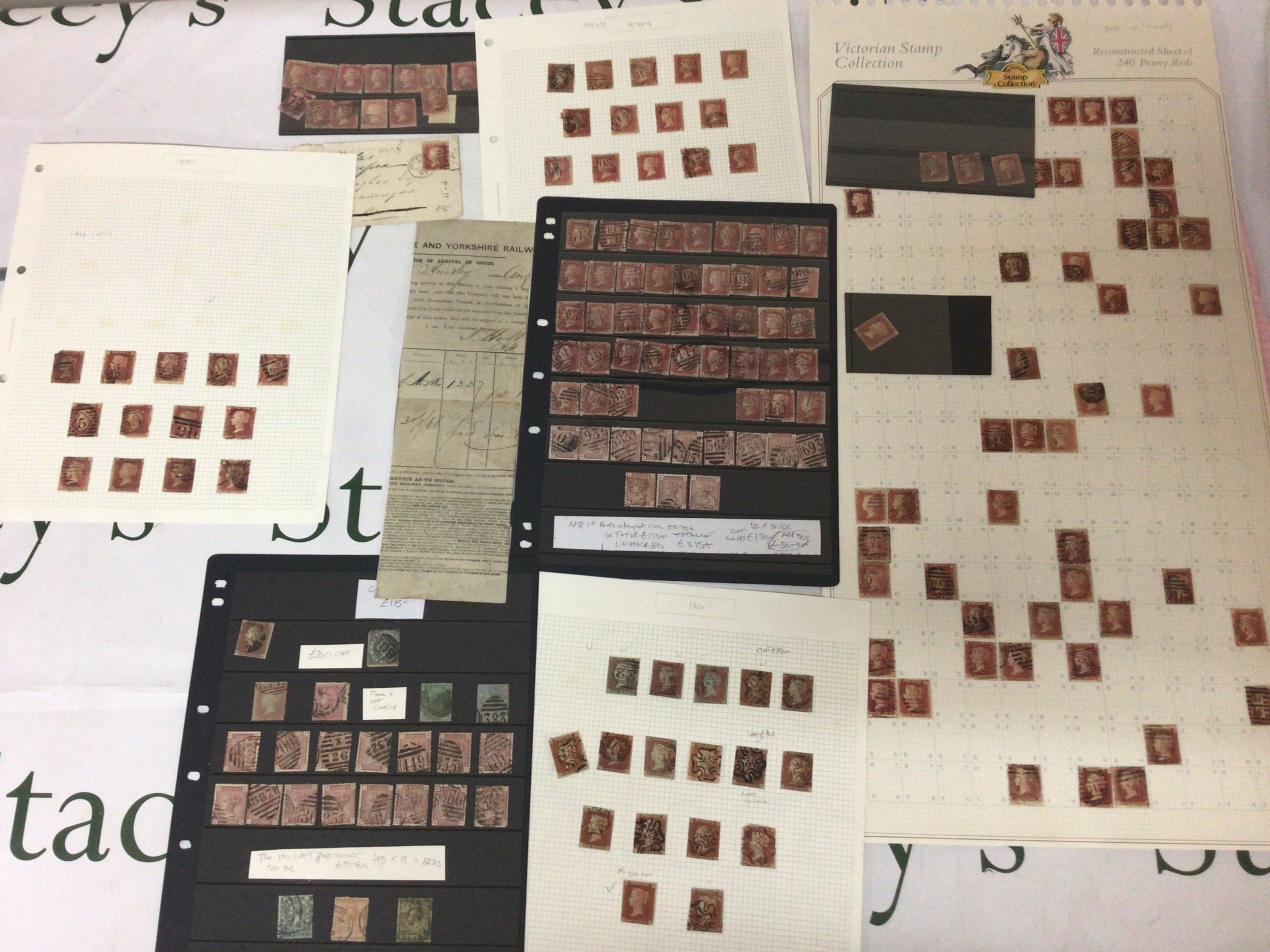A collection of Victorian penny red stamps including a section of a Yorkshire Railway notice arrival of goods and other used Victorian penny and other stamps.