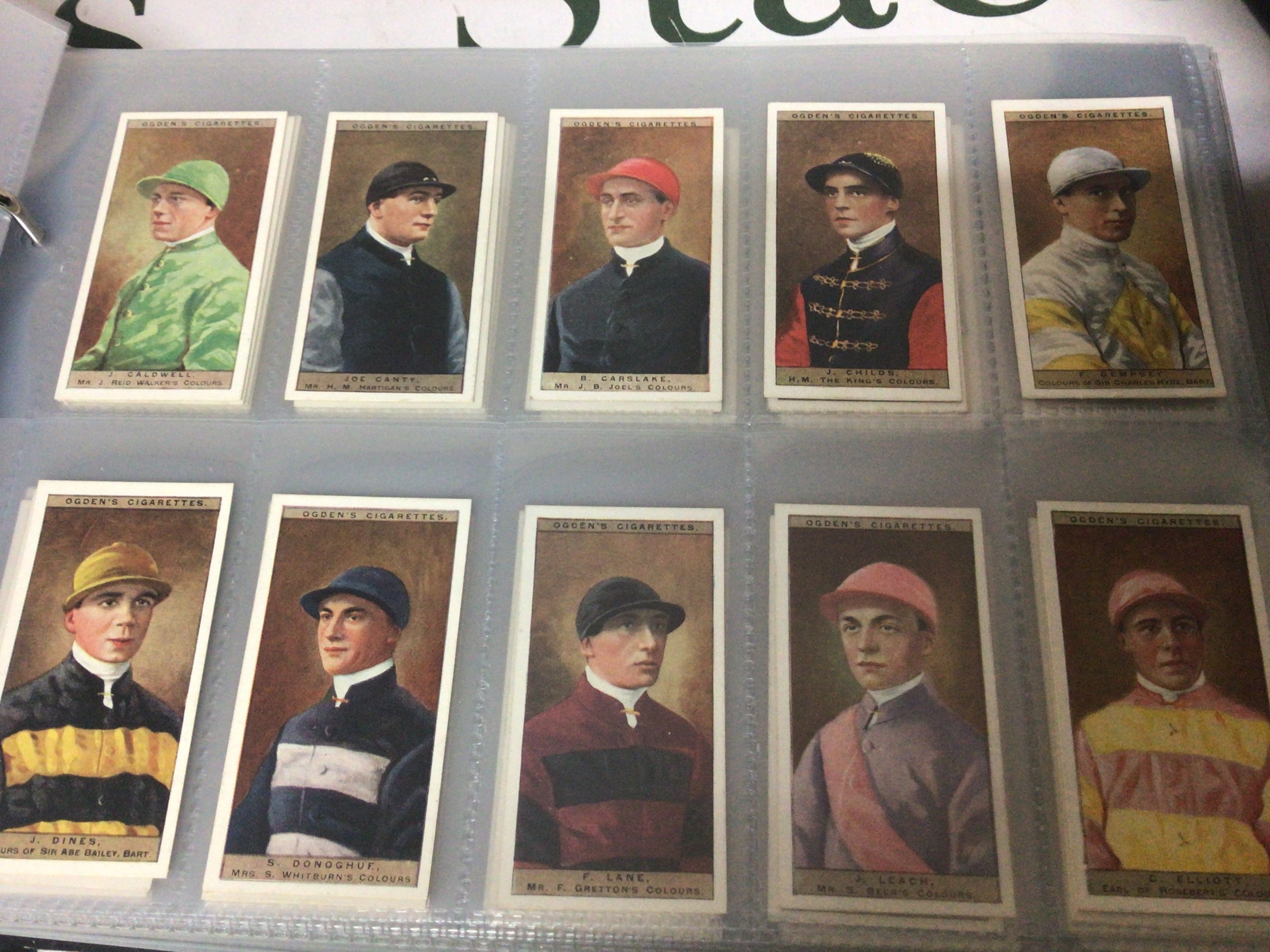 A Collection of five well presented albums containing cigarette cards some post cards vintage cigarette covers. Ogdens Jockeys and Owners Colours and many others.