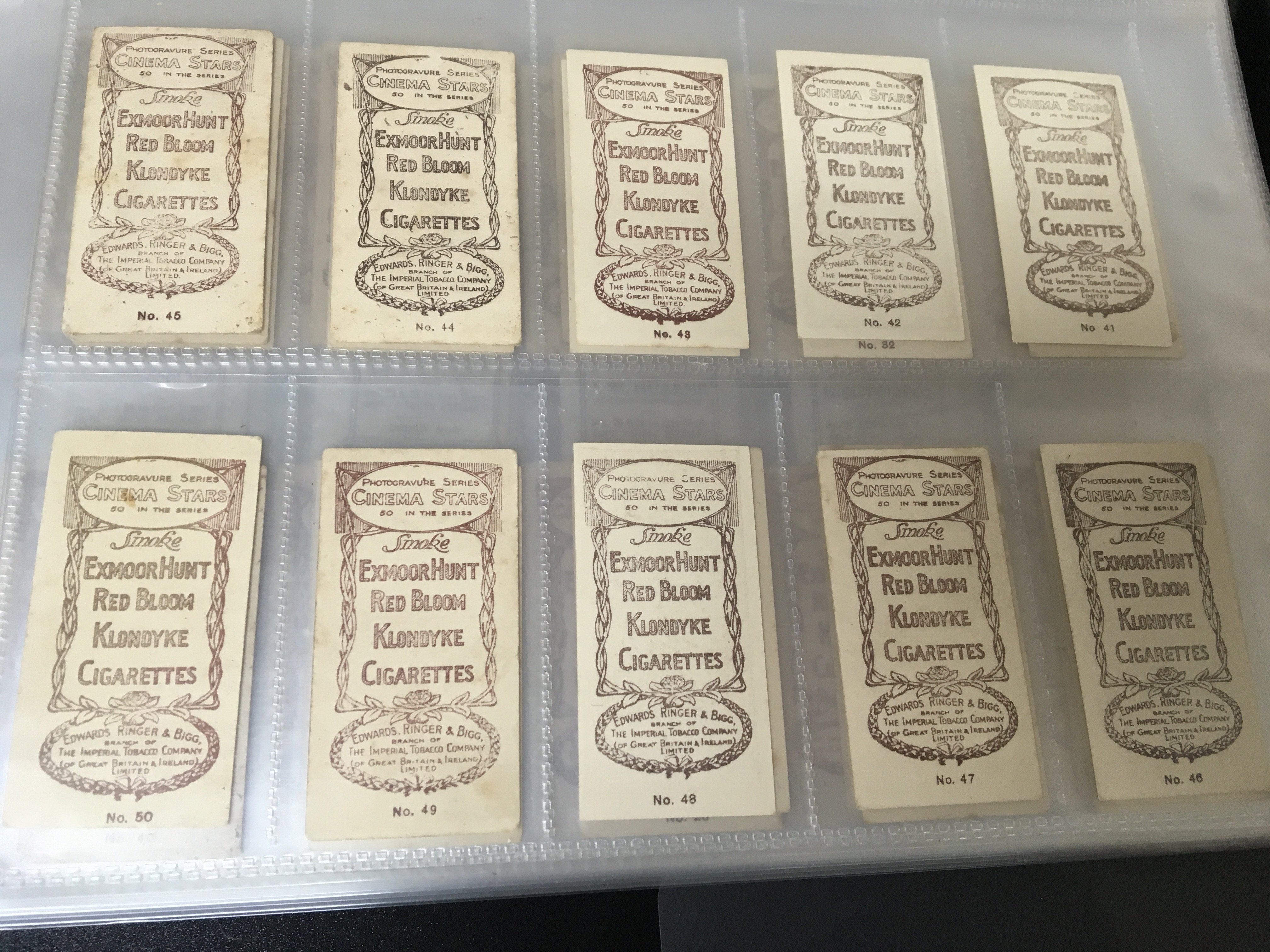 Three well presented albums containing numerous vintage cigarette cards and other collectors cards including B.D.V Godfrey Phillips Test Cricket 1932/33 Screen Stars Bird Painting Adrath Tobacco Trooping the Colour Edwards Ringer & Bigg Cinema Stars and many other vintage sets. (3)