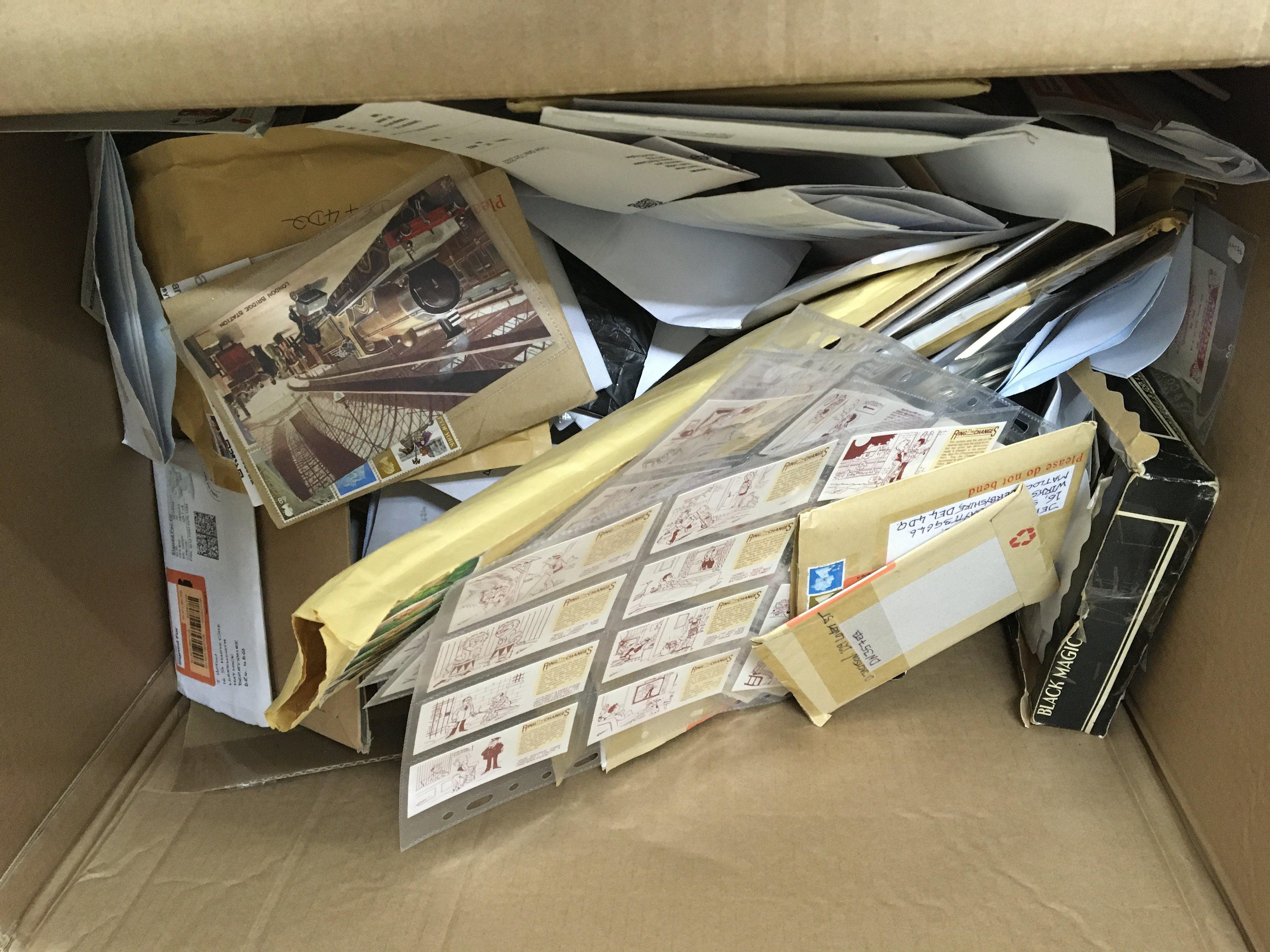 A box containing a large quantity of unopened postage envelopes containing numerous unsorted mixed Vintage cigarette cards and vintage postcards.