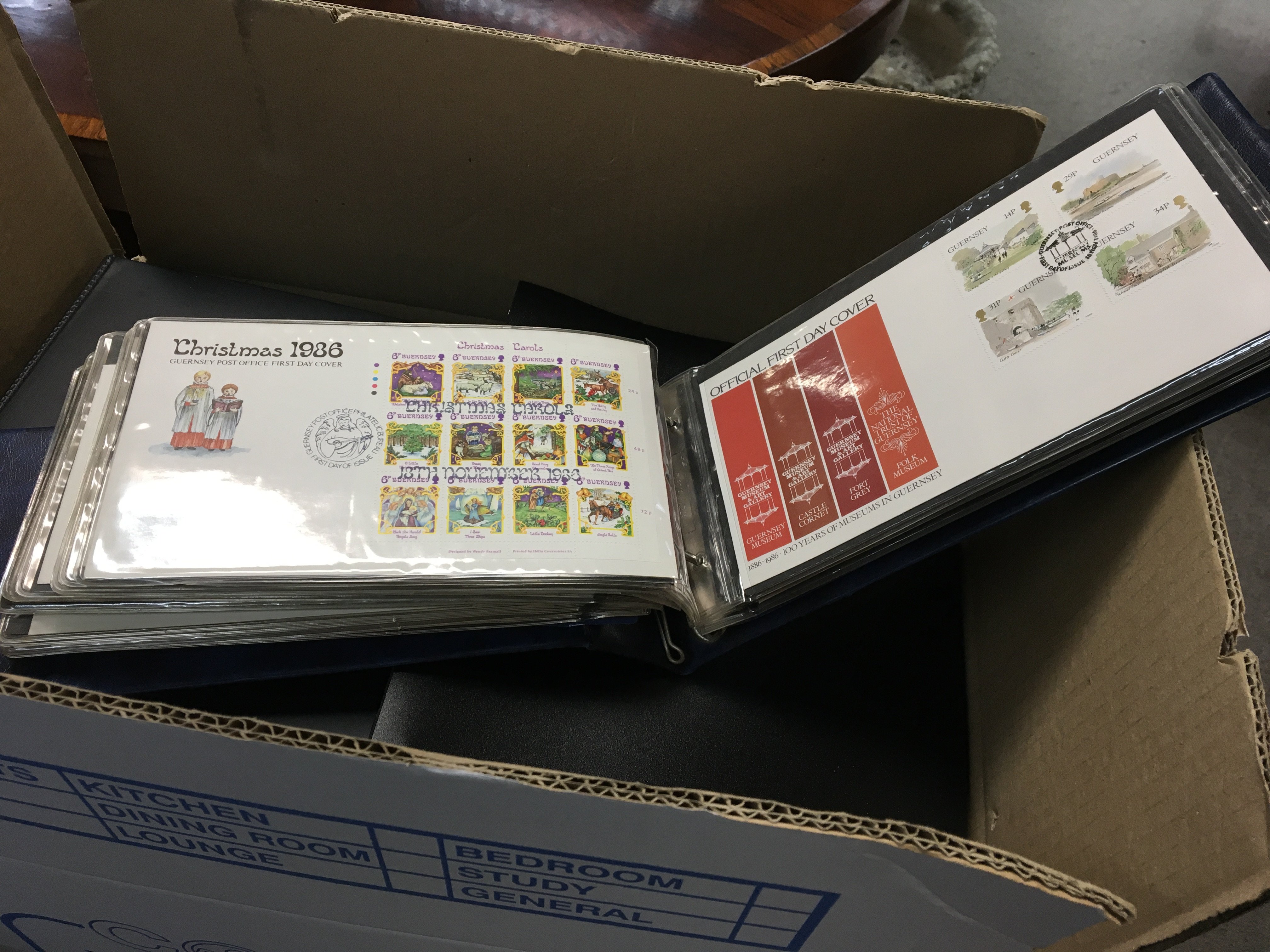 A box containing numerous albums of First day postal Covers.