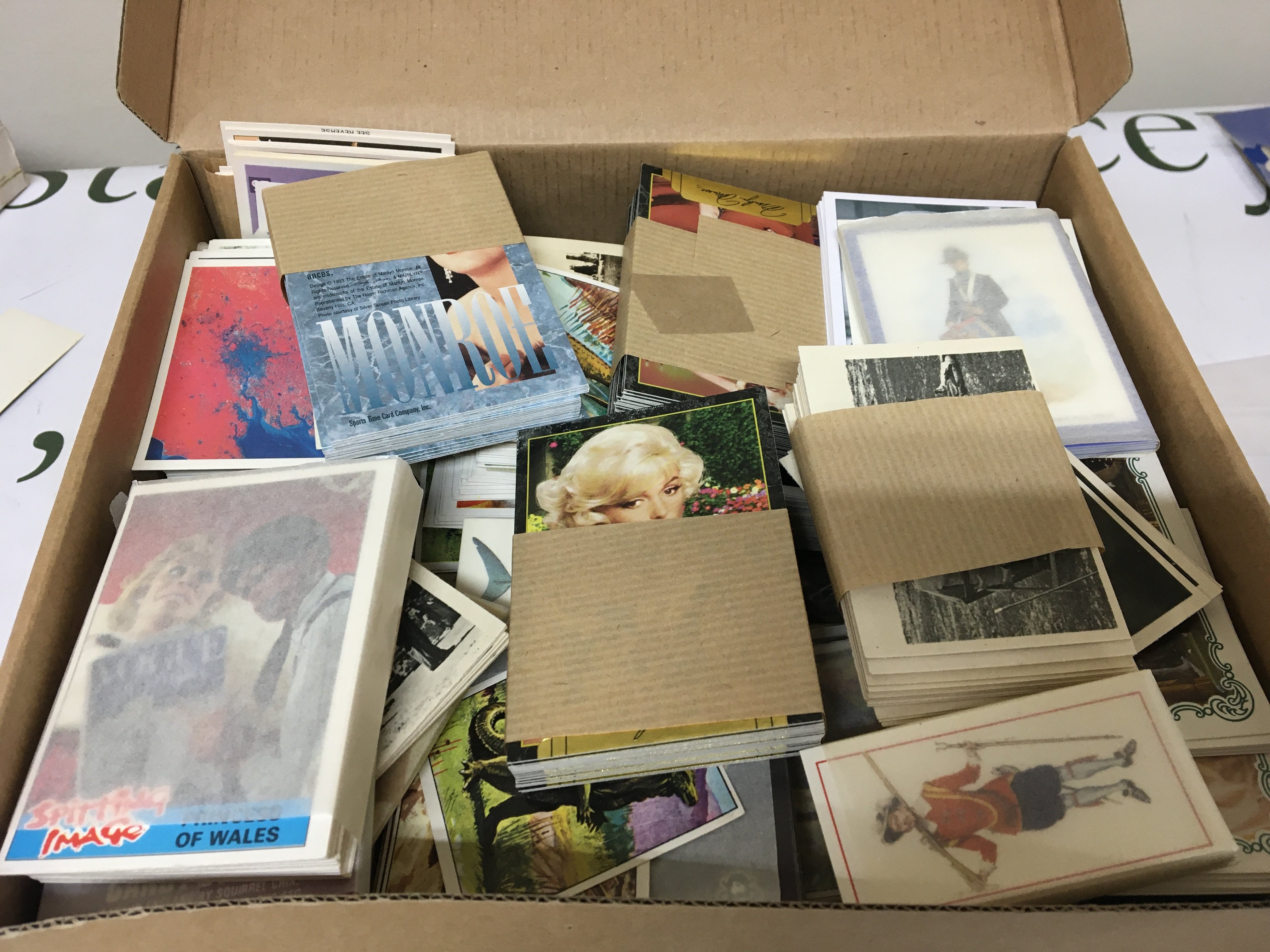 A box containing a large quantity of sets of collectors cards Sporting time card company ABC cards Candystick cards Splitting image cards and many more
