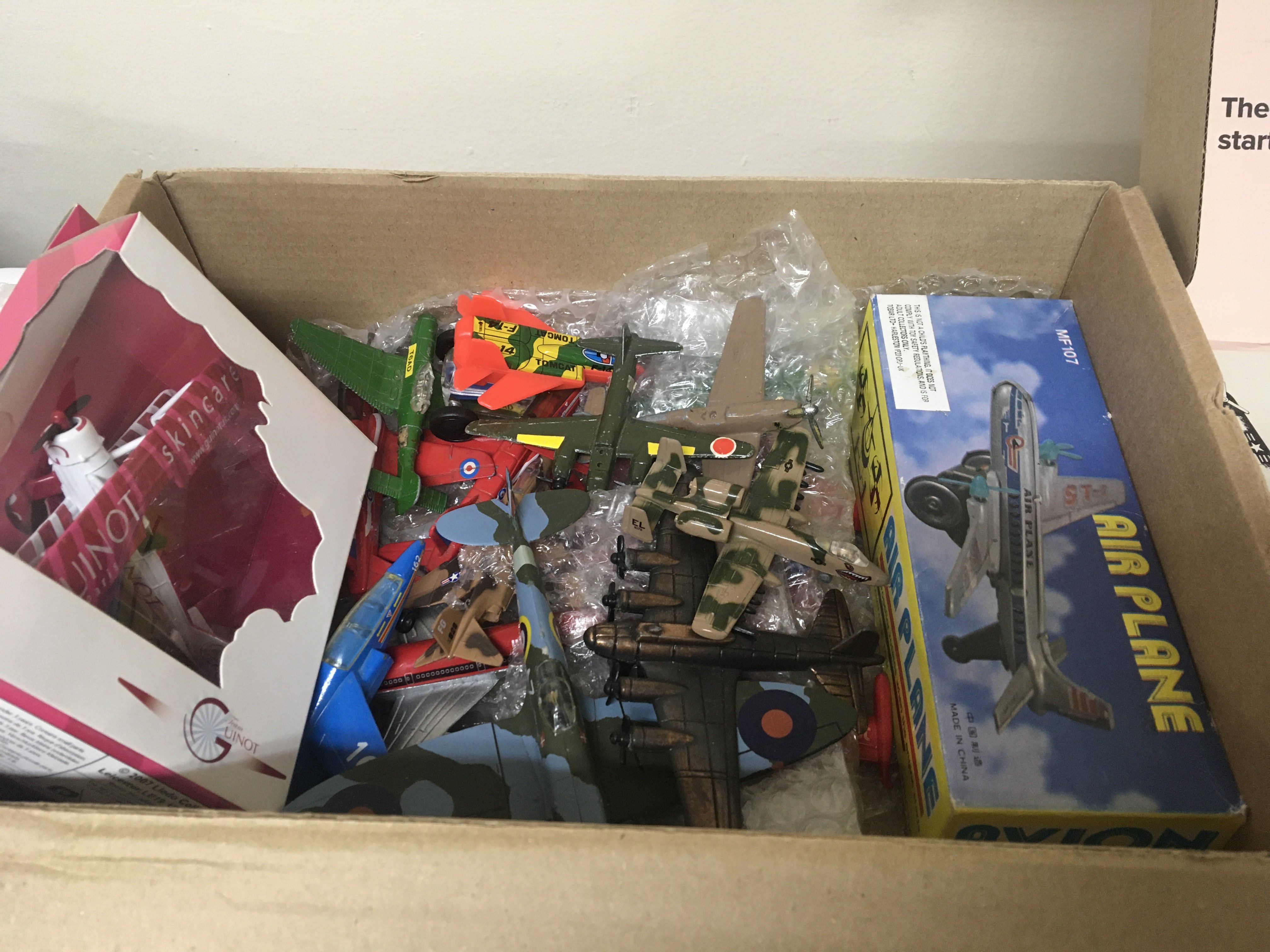 A collection of model aircraft and commercial helicopter models.