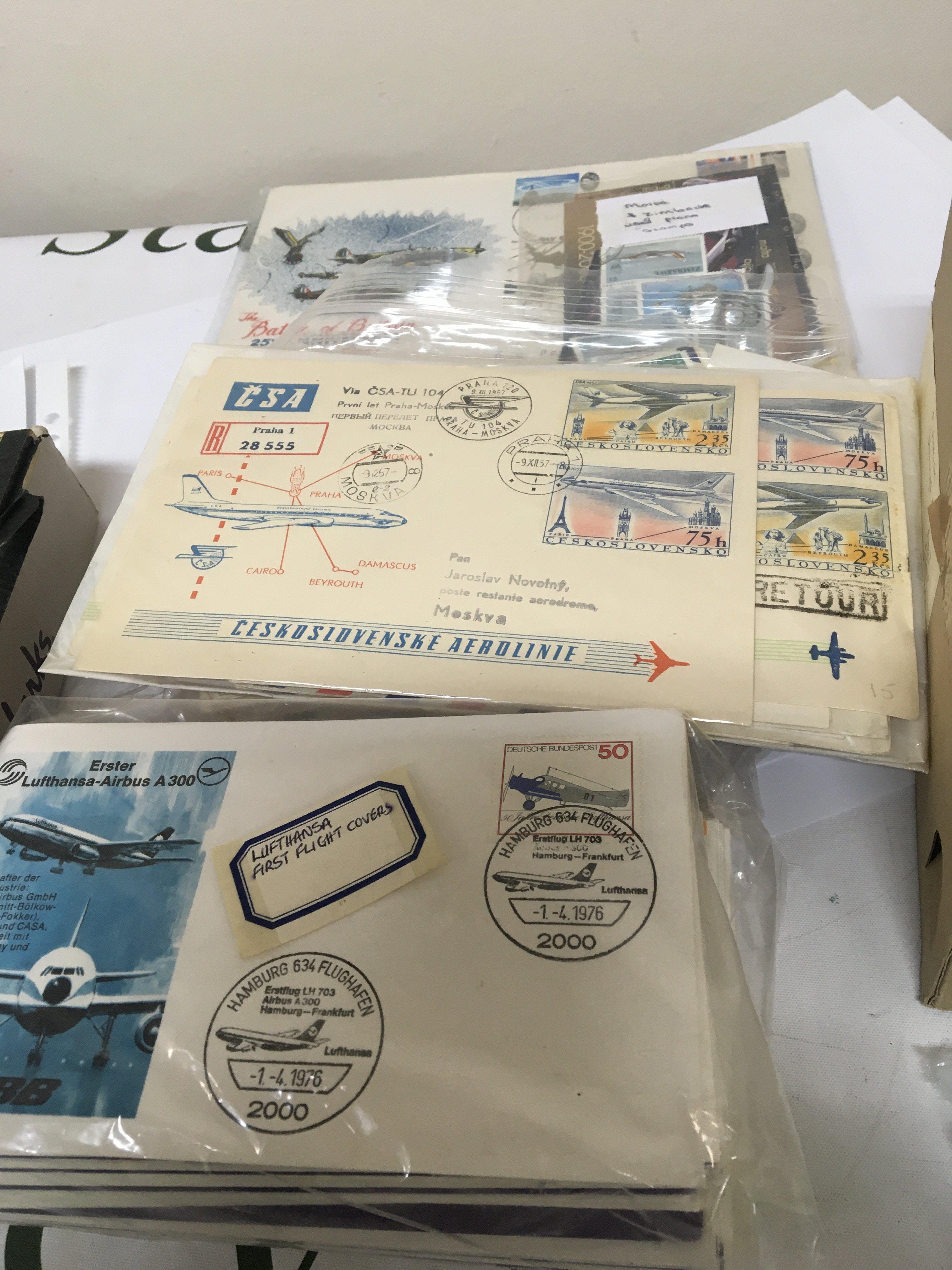 A box containing Aviation First Flight stamp covers aviation presentation stamp packs and other stamps
