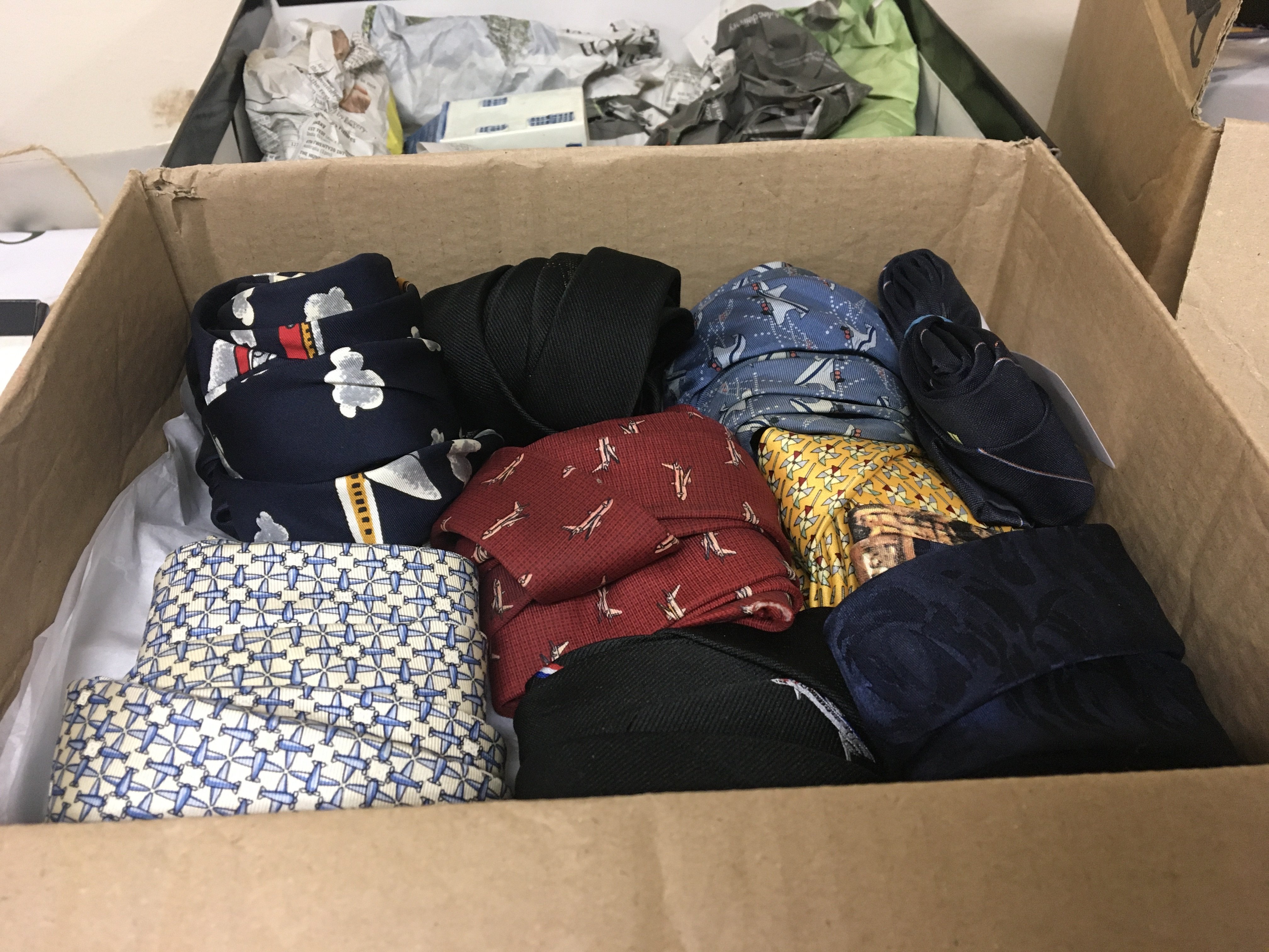 A box containing Aviation ties ceramics and one other box of aircraft collectibles. (3)