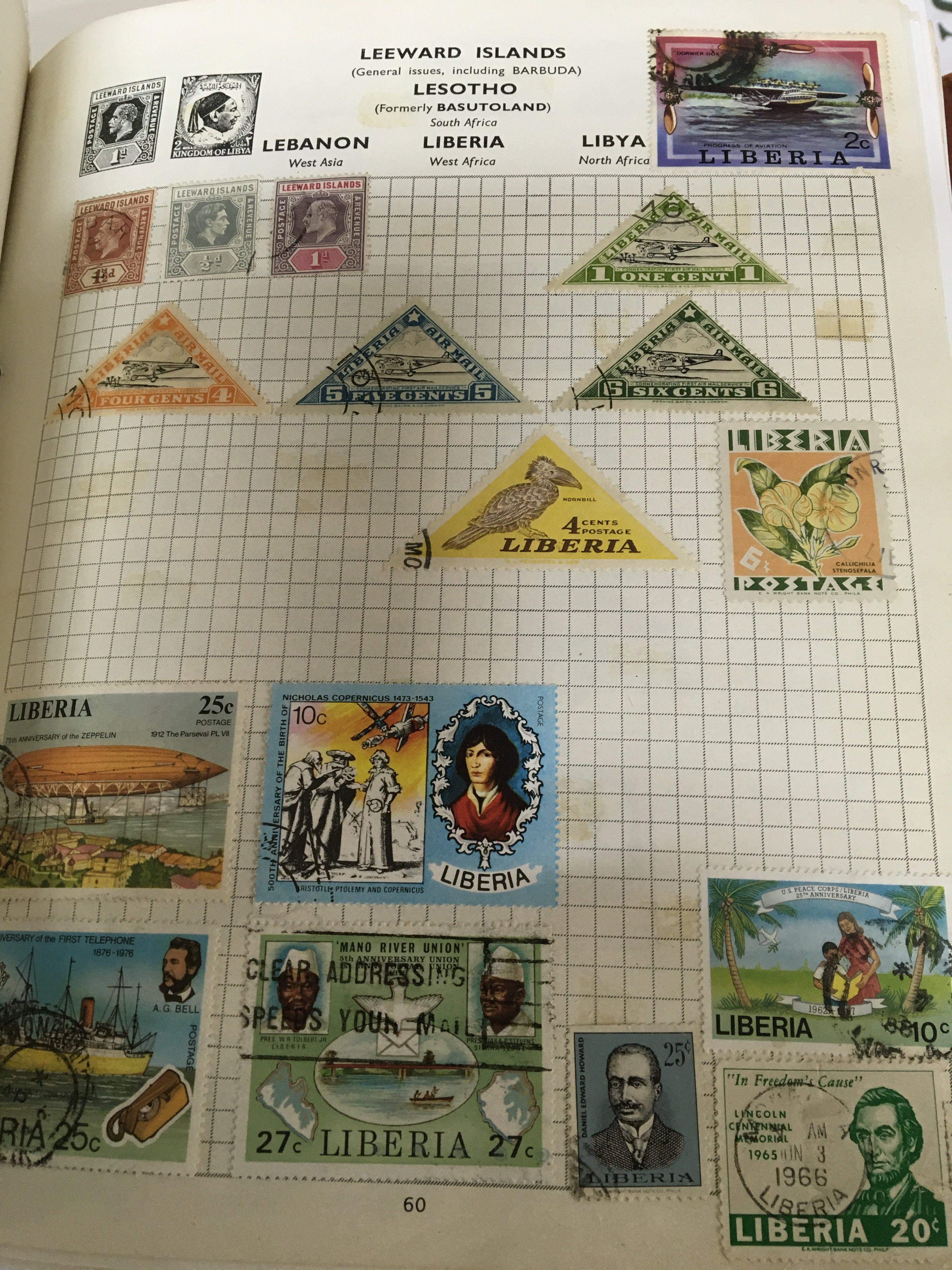 Two albums containing an A-Z of world stamps mainly used most second half of the 20th century a box containing a quantity of small stock books containing mixed stamps and a box of first day covers.