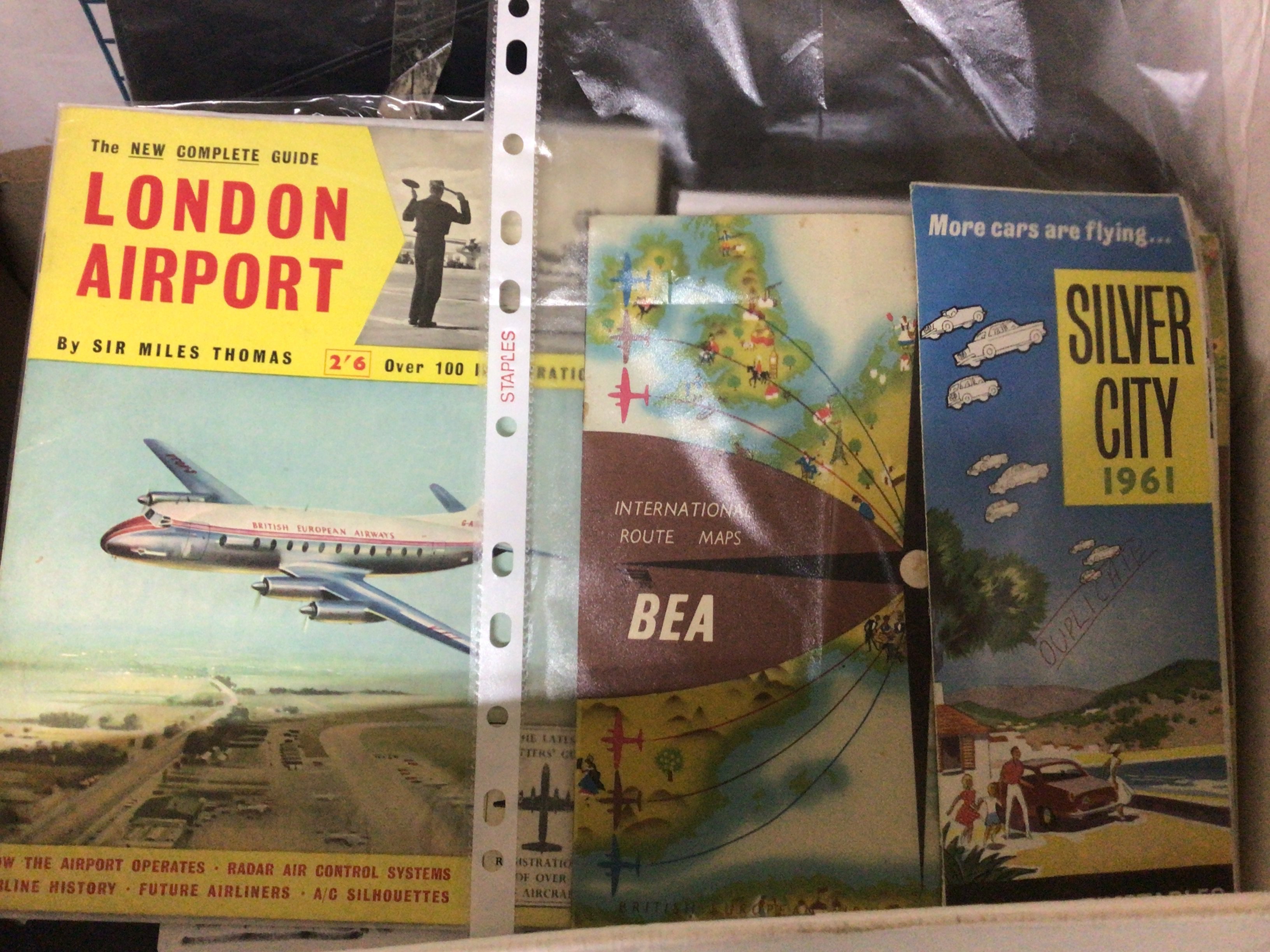 A Box containing an intresting comprehensive collection of ephemera The Modern History of Southend Airport including photographs news paper cuttings and also two Concorde flight pouches containing notebooks and a tie.