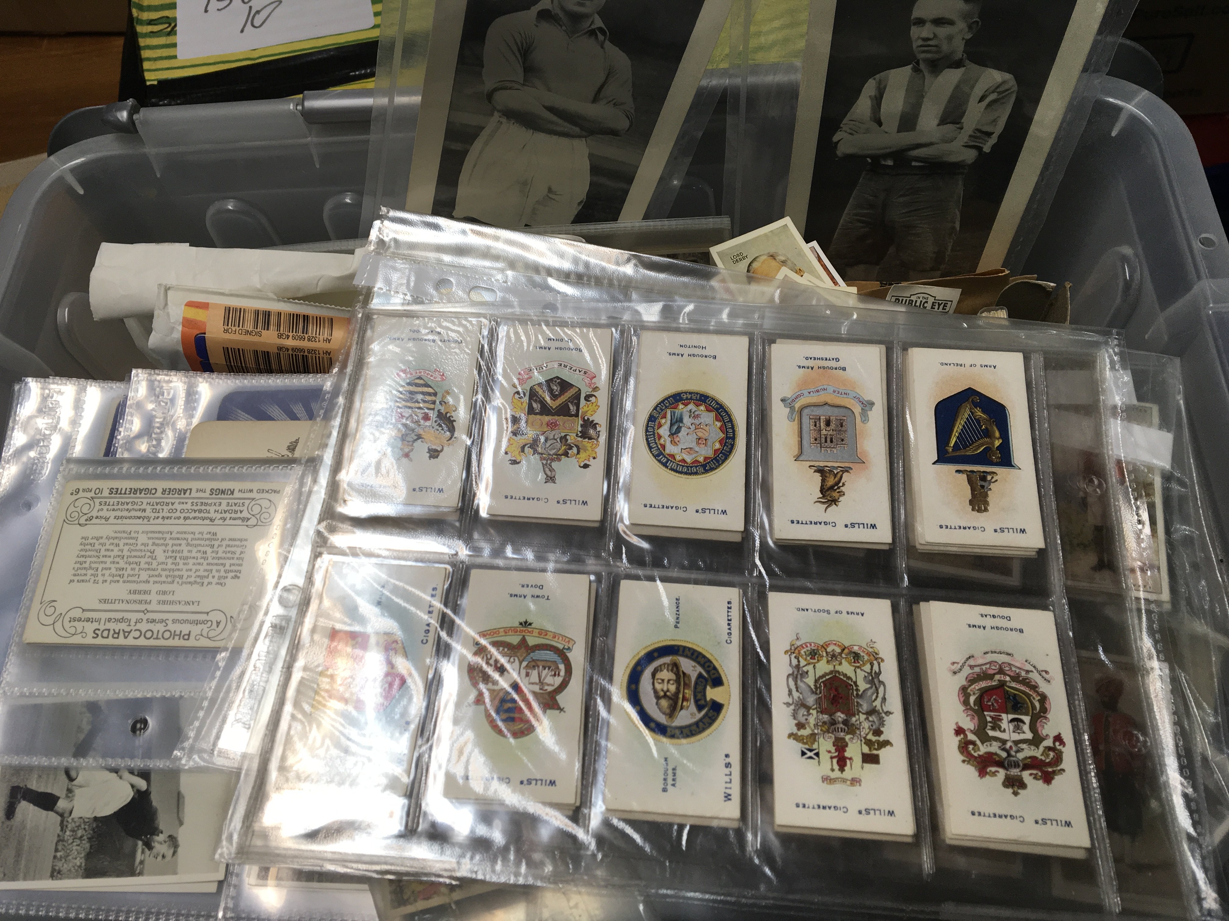 A box containing an extensive collection of vintage cigarette cards and other trade cards and some postcards.