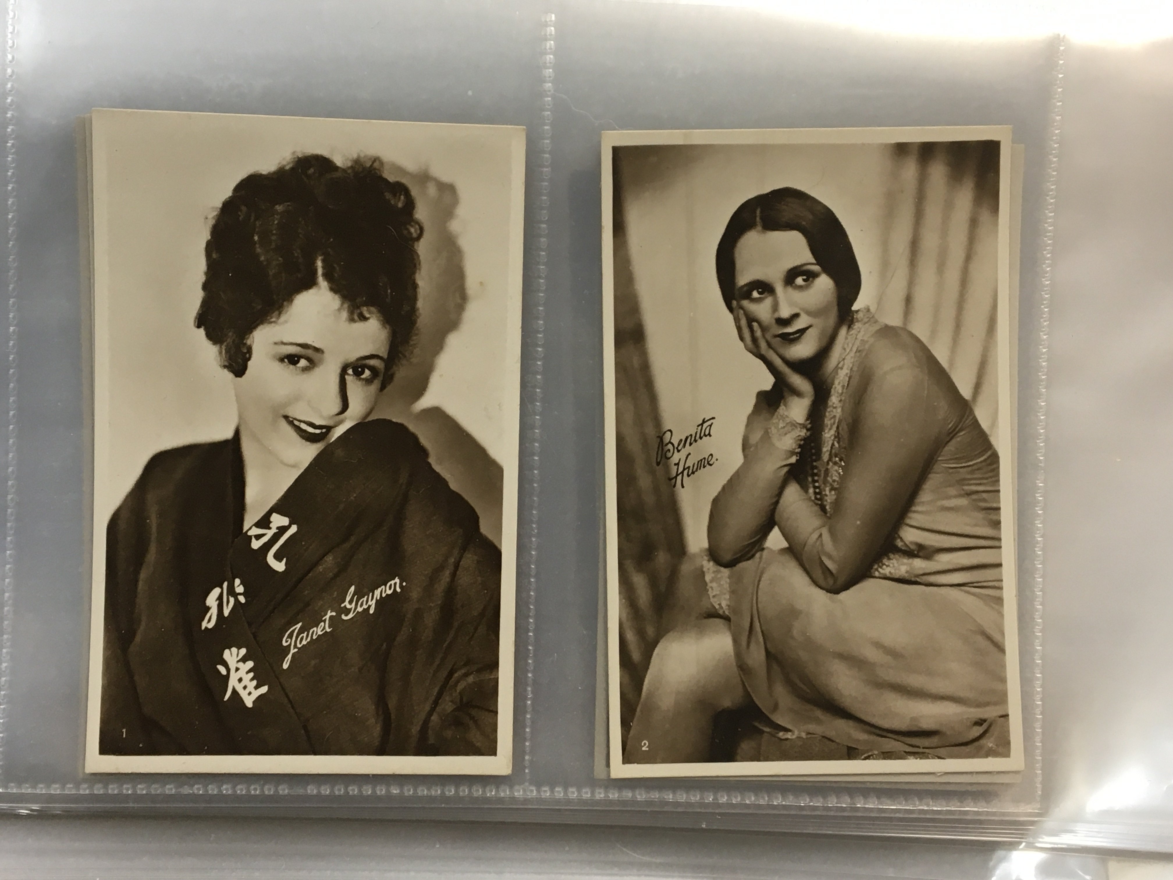 A box containing albums of world stamps mainly used second half of the 20th century albums of first day covers and albums of Vintage postcards.