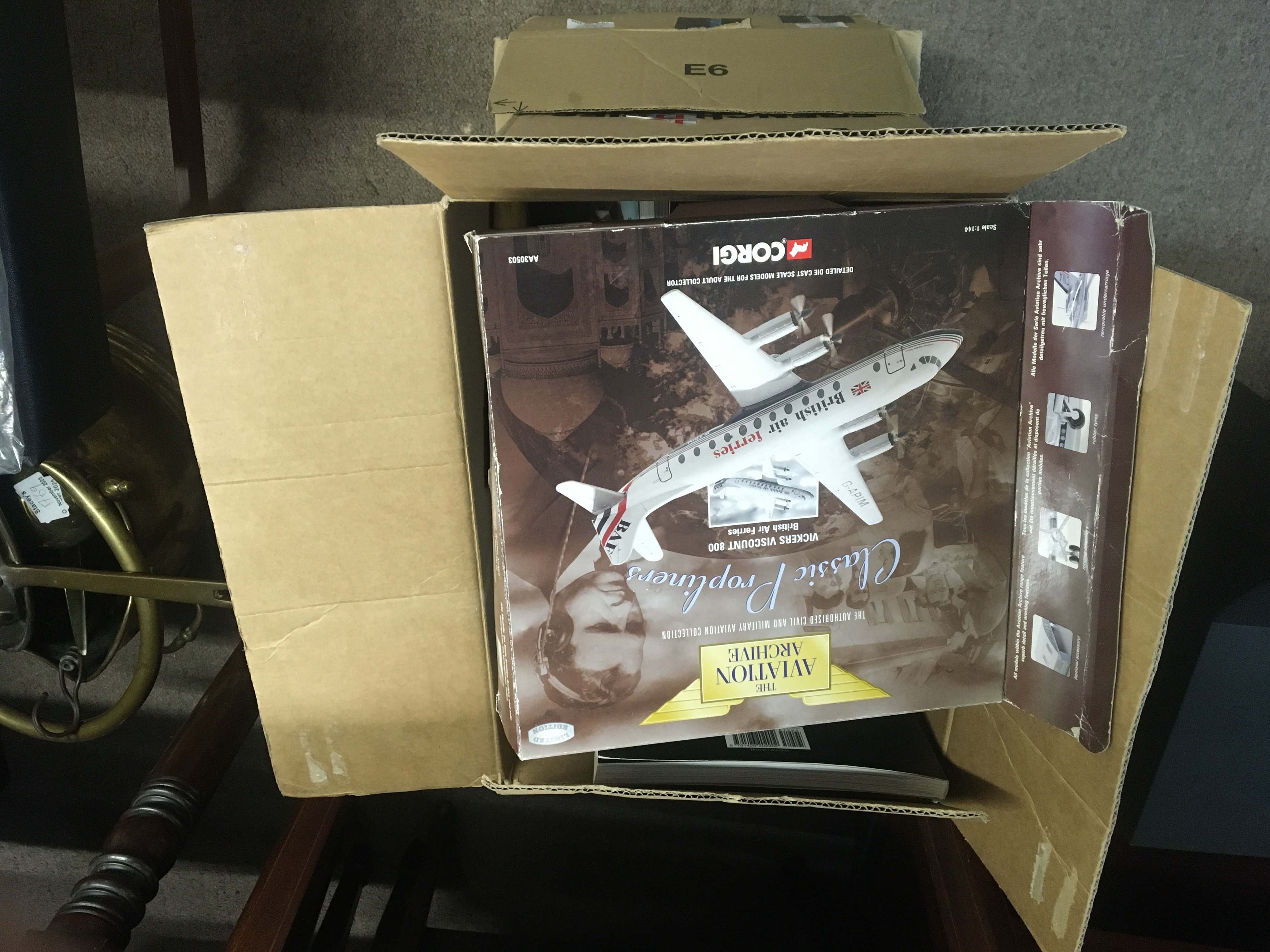 Two boxes containing Aircraft memorabilia books Aviation Aircraft models Civil airplanes badges and other oddments. (2)