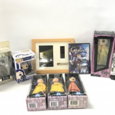 A Collection of Boxed Coraline Figures. A Coraline Framed Film Cell. A Monster High Frankie Stein Doll Etc.