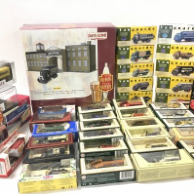 4 boxes containing boxed diecast model vehicles by Corgi..Lledo..EFE..Vanguard and others. Includes a large selection of Brewery livery.