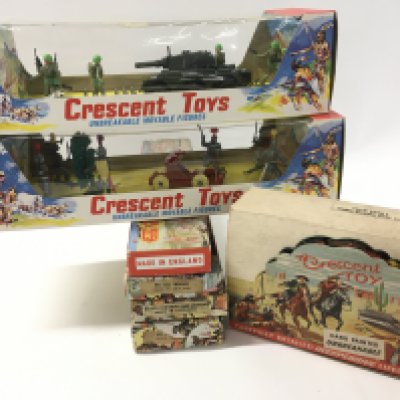 A collection of boxed Crescent toys featuring..cowboys..Indians..soldiers..knights no reserve