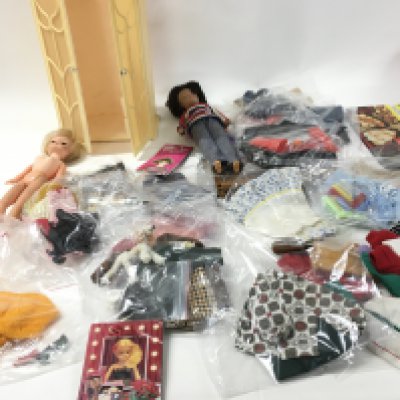 A collection of Sindy vintage clothing in excess of 10 outfits and accessories. Also two vintage Sindy dolls..No reserve