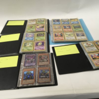 A collection of 5 albums containing Pok&eacute;mon cards . album 1 contains Jungle Rocket.. album 2 contains Fossil.. album 3 contains YU G Oh cards..album 4 contains original base set.. album 5 has 15 pages holding approximately 270 cards.