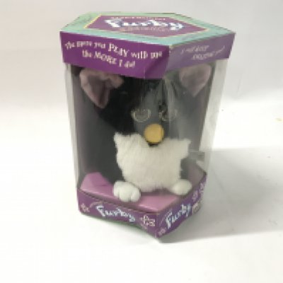 An original Furby in box. Box is worn. No Reserve