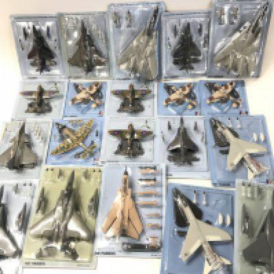 A Box Containing Fighter Aircraft Models and A Binder Of Magazines.