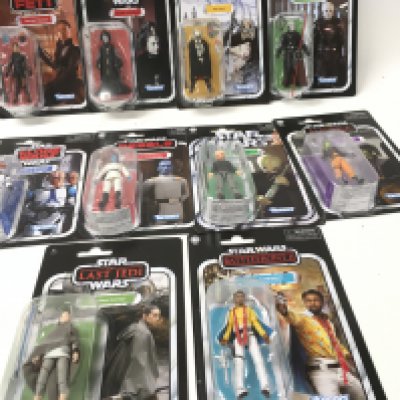 A collection of Star Wars figures all in original unopened packaging.