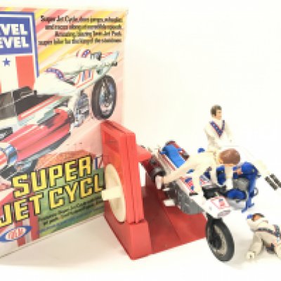 A Boxed Ideal Toys Evel Knievel Super Jet Cycle. Also. Chopper Bike And Extra Figure. Super Cycle Has New Decals Fitted.