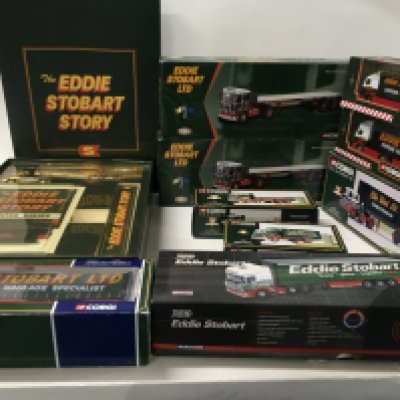 A collection of 10 boxed Corgi diecast model commercial vehicles all themed Eddie Stobart. Includes a sights and sounds edition. Also includes the gold plated boxed Eddie Stobart Story.