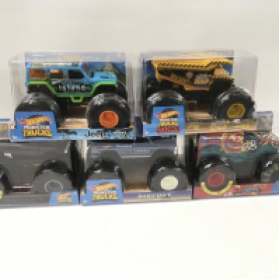 A collection of 5 unopened Hot Wheels Monster Trucks includes ..Island Jeep..Gotta Dump..Dodge Charger..Bigfoot 4x4x4.. Demo Derby. No reserve