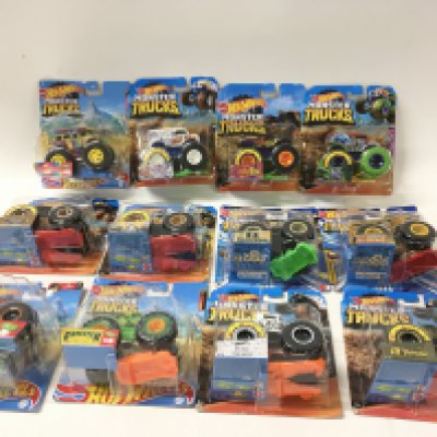 A collection of 12 unopened Hot Wheels Monster Trucks 1:64 scale. Includes Bone Shaker ..Milk Monster plus others. No reserve