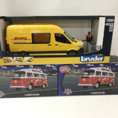 A group of 3 boxed model vehicles 2 x Volkswagen Campervans by Chad Valley and a Mercedes van in DHL livery by Bruner. No reserve