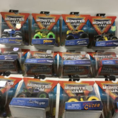 A collection of 12 unopened boxed Monster Jam model vehicles 1:64 scale includes ..Iron Outlaw..Zombie.. plus others. No reserve