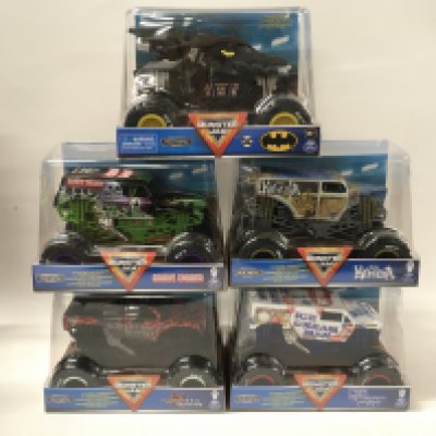 A collection of 5 unopened Monster Jam monster trucks 1:24 scale. Includes Batman..Grave Digger and others. No reserve