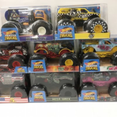 A collection of 8 unopened Hot Wheels Monster Trucks 1:24 scale. Includes Cajun Crash..Bone Shaker plus others. No Reserve