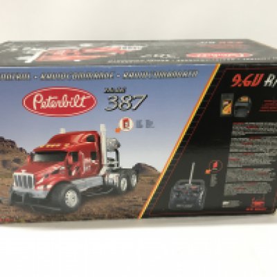 A boxed Peterbilt radio controlled model truck . Model 387. By New Bright Toys.