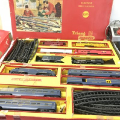 Two boxed Triang model railway sets Nos. RS15 and RS14 includes two transformer power units. Also a boxed Minic motor racing set FRONTIER POST Motor Rally. (4)
