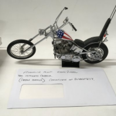 A pair of Franklin mint Easy Rider Chopper Motorcycles from the Film EASY RIDER. includes Billy Bike 1969 panhead chopper flames tank 1:10 plus the hat .. also 1:10 scale Captain America Harley Davidson Stars and Stripes tank. both COAs.