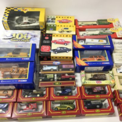 A collection in excess of 25 boxed diecast vehicles manufactured by Corgi..Lledo..Maisto etc. includes items from the Vanguards series..Cameo series plus others. No reserve