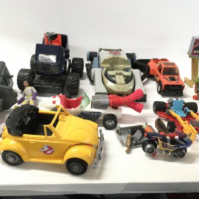 A collection of vintage vehicles ..accessories and figures from Ghostbusters..Mask..Thundercats and Turtles.