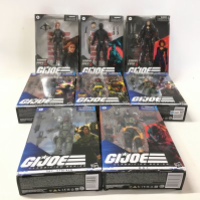 A collection of 8 boxed GI Joe classified action figures.